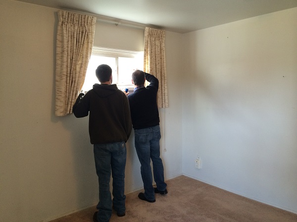 My dad and Jimmy inspecting the house.