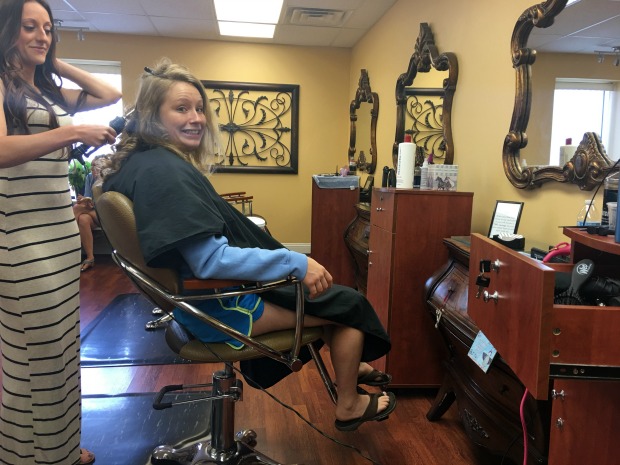 Having hair curled at salon