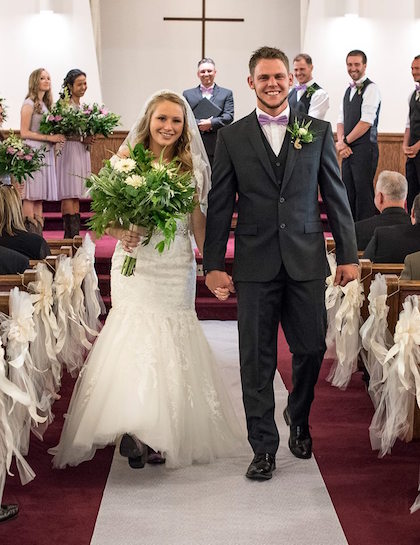 Bride and groom walking down the aisle