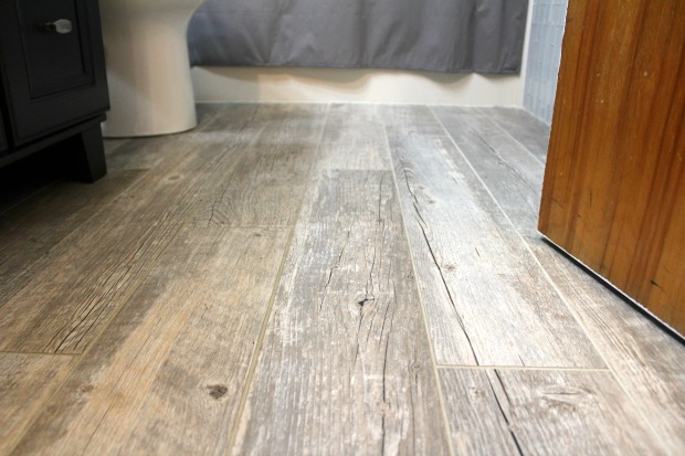 Gray woodgrain tile wood floor in bathroom 