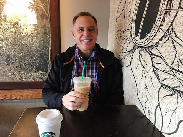 Man in Starbucks with large iced coffee