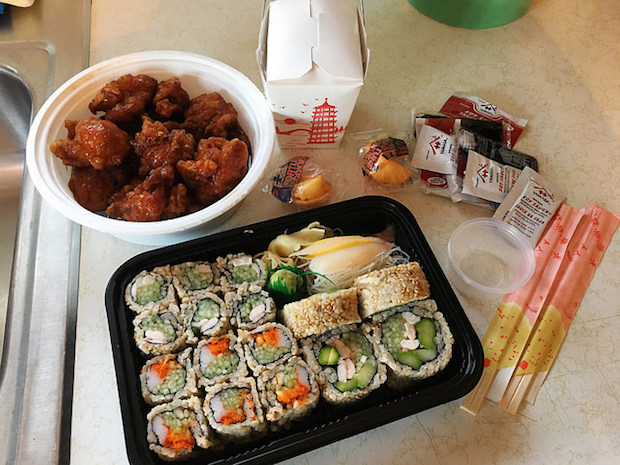Sushi and General Tso's Chicken with fortune cookies, rice, soy sauce, and chopsticks from Osaka Pittsburgh