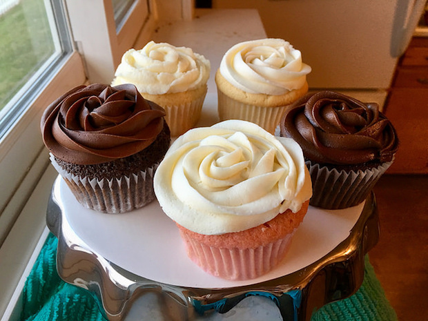 chocolate, strawberry, lemon, and vanilla cupcakes on cake stand