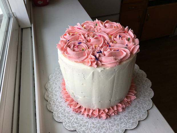 Strawberry birthday cake with vanilla buttercream and sprinkles