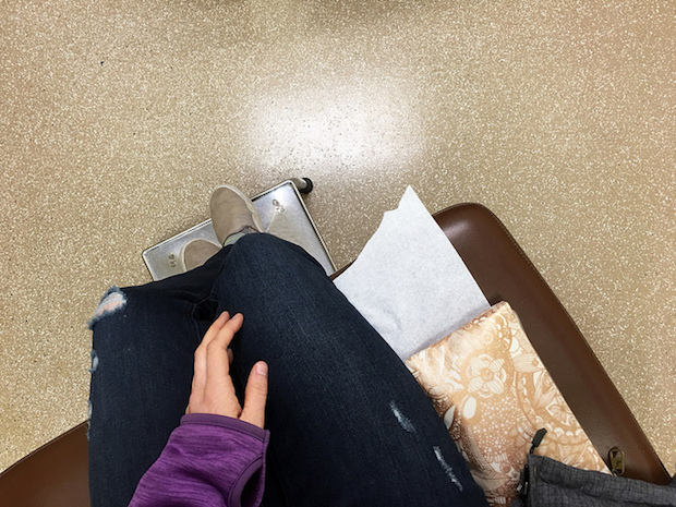 Sitting on exam table at doctor's office