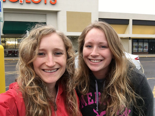 Sisters with blonde wavy curly hair selfie smiling