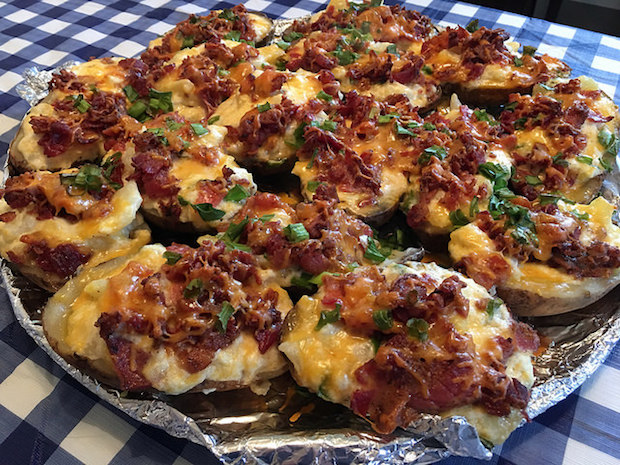 Loaded twice baked potatoes with bacon and green onions