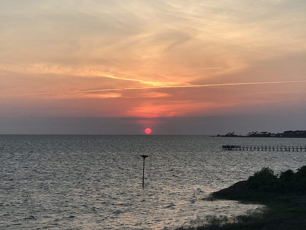 Sunset overlooking Sound at Jockey's Ridge State Park in Outer Banks North Carolina Nags Head