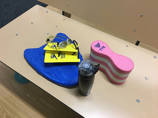 Swimming kick board, pull buoy, paddles, and Thermos Intak waterbottle