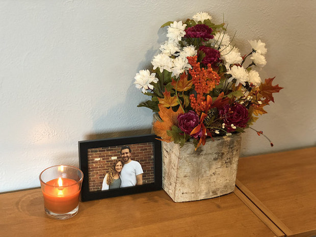 Fall flower arrangement with pumpkin candle for fall decor