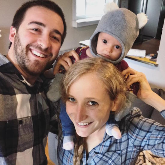Family picture with baby on mom's shoulders