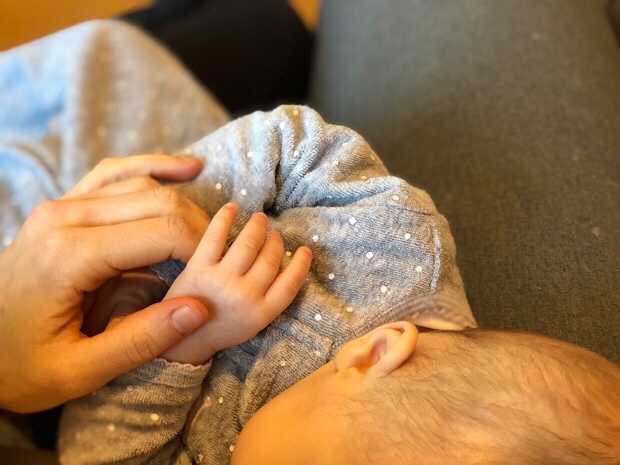 Holding baby hand