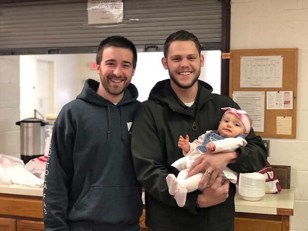 Two guys with baby girl