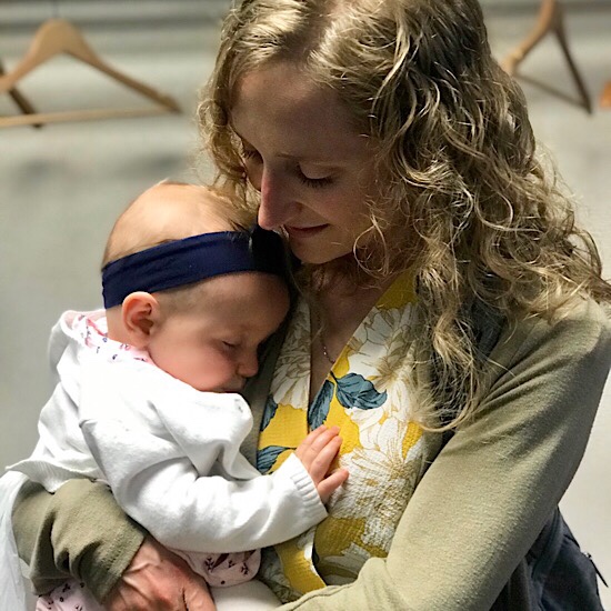 Mom holding baby girl