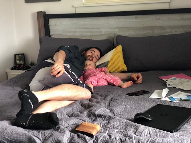 Dad and baby sleeping together