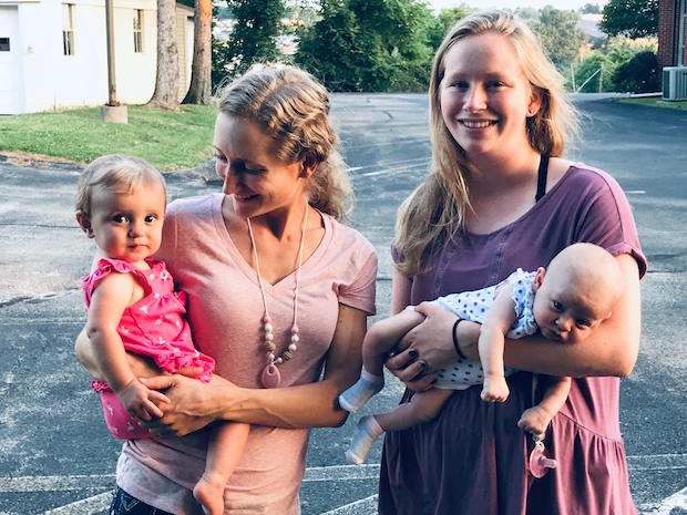 Sisters with baby girl daughters