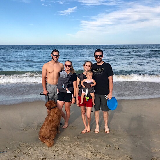 Couples on beach with dog and babies