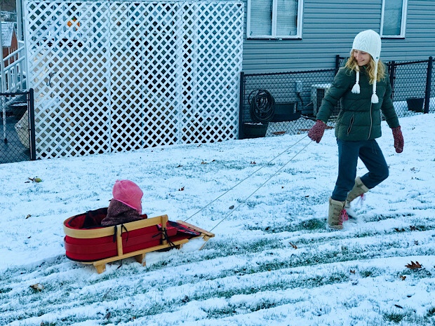 Mom pulling baby in L.L. Bean sled