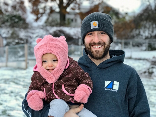 Father and baby in snow