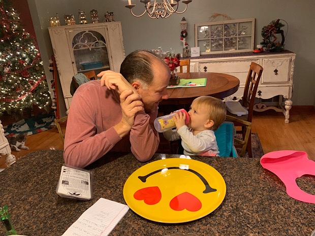 Grandpa with toddler and smile plate