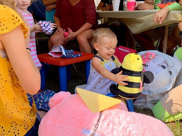 Baby with stuffed bumble bee