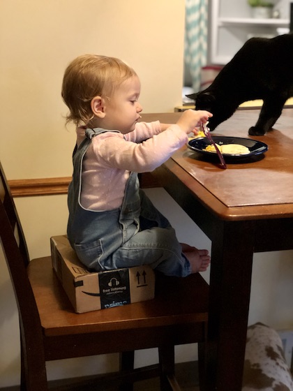 Baby eating breakfast