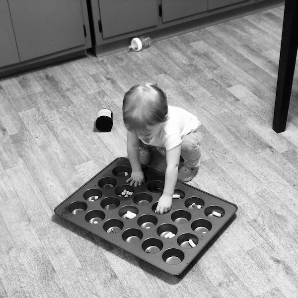 Toddler activity eating out of muffin pan