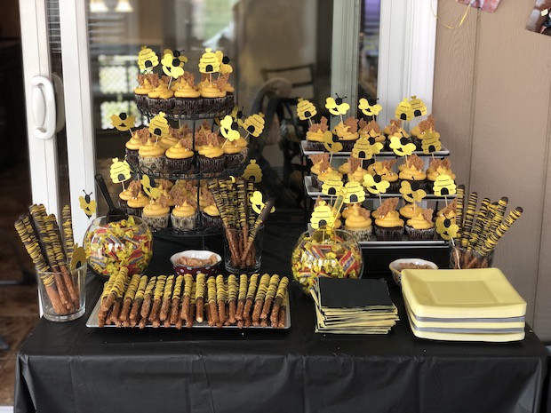 Bee themed first birthday cupcakes and chocolate covered pretzels