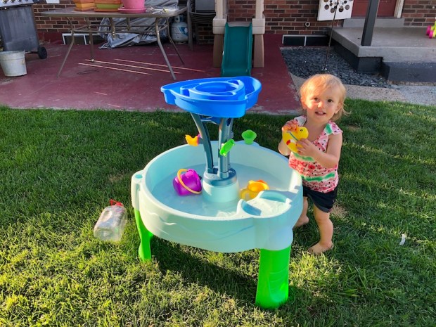Toddler with water table 