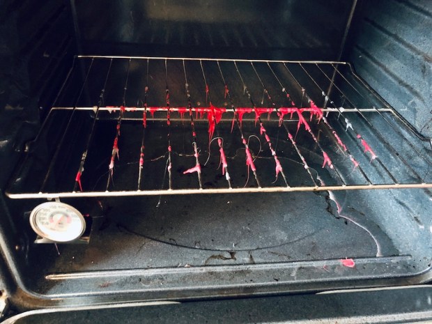 Oven rack with melted plastic