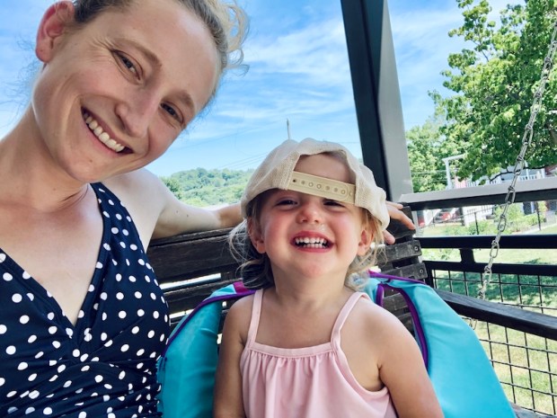 Mom and toddler daughter in swim clothes