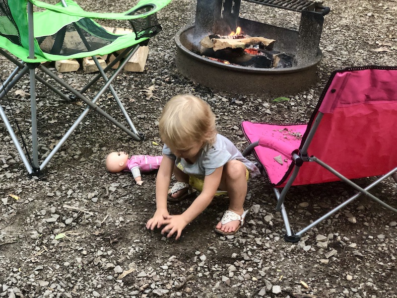 Toddler playing in dirt and rocks while camping at Ohiopyle State Park