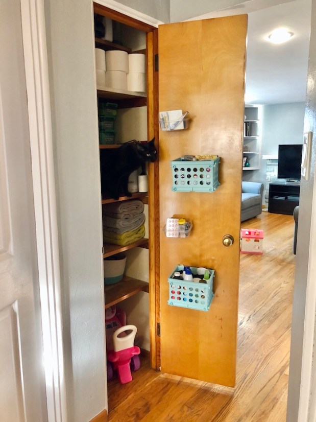 Closet organization with baskets on door