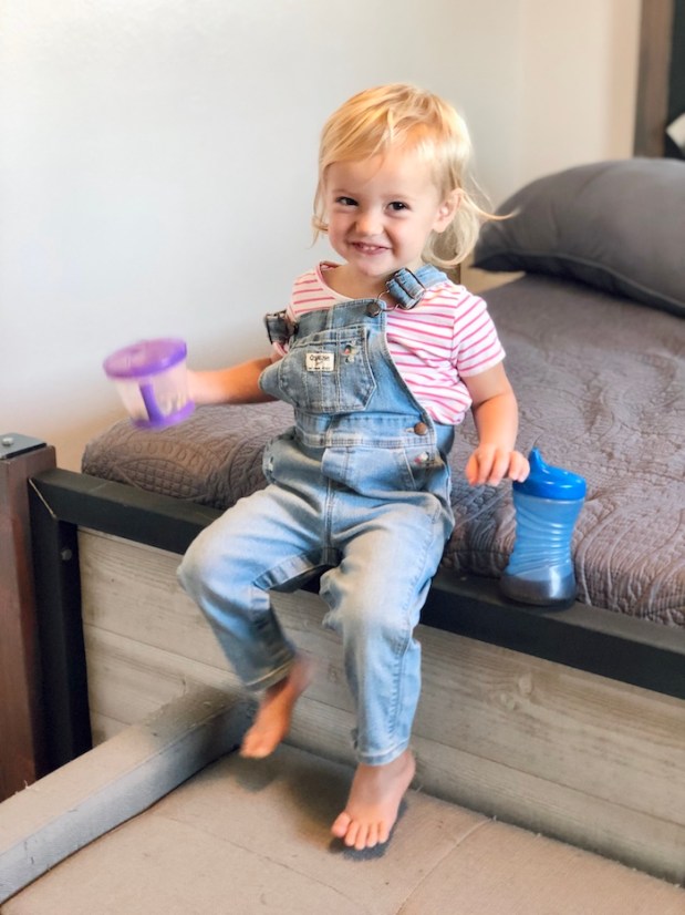 Toddler in overalls