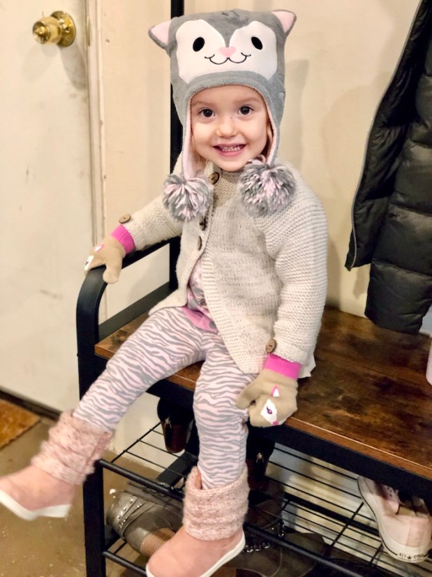 Toddler wearing cat hat