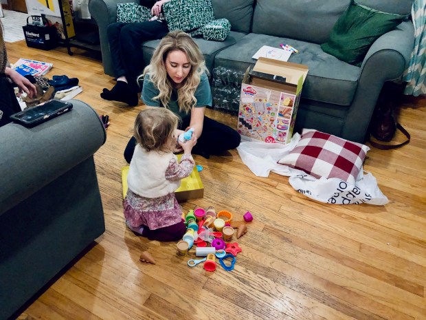 Aunt and niece playing with play doh