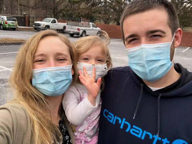 Family with masks on
