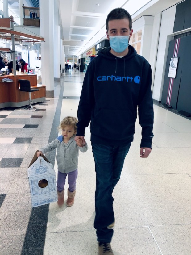 Father and daughter walking at mall with Build-A-Bear box in Pittsburgh, PA