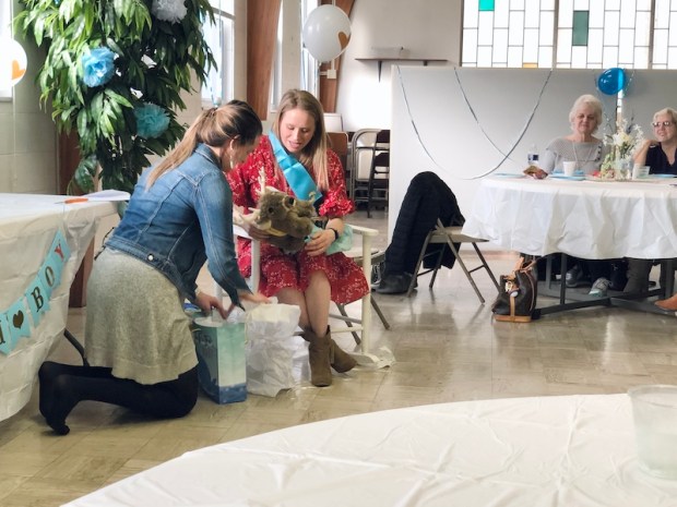 Opening baby shower gifts for boy