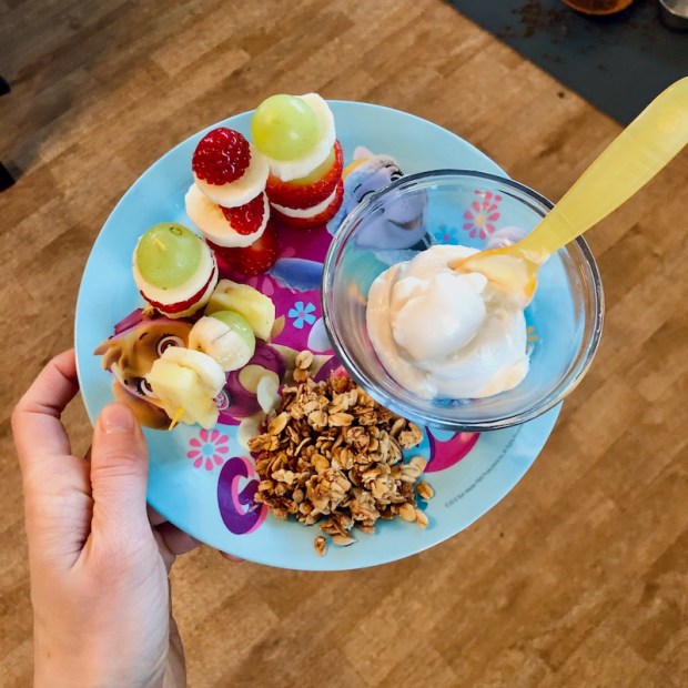 Toddler breakfast with fruit, yogurt, and granola