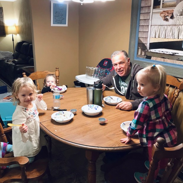 Grandpa with three toddler granddaughters