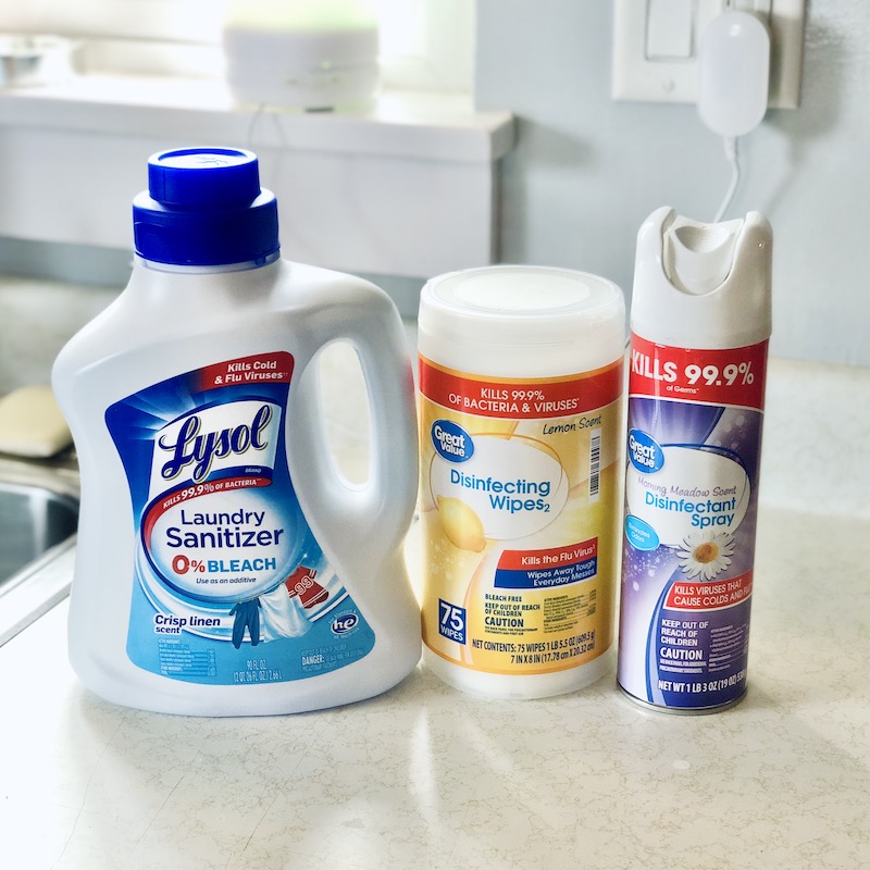 Lysol laundry sanitizer, disinfecting wipes, and disinfectant spray.