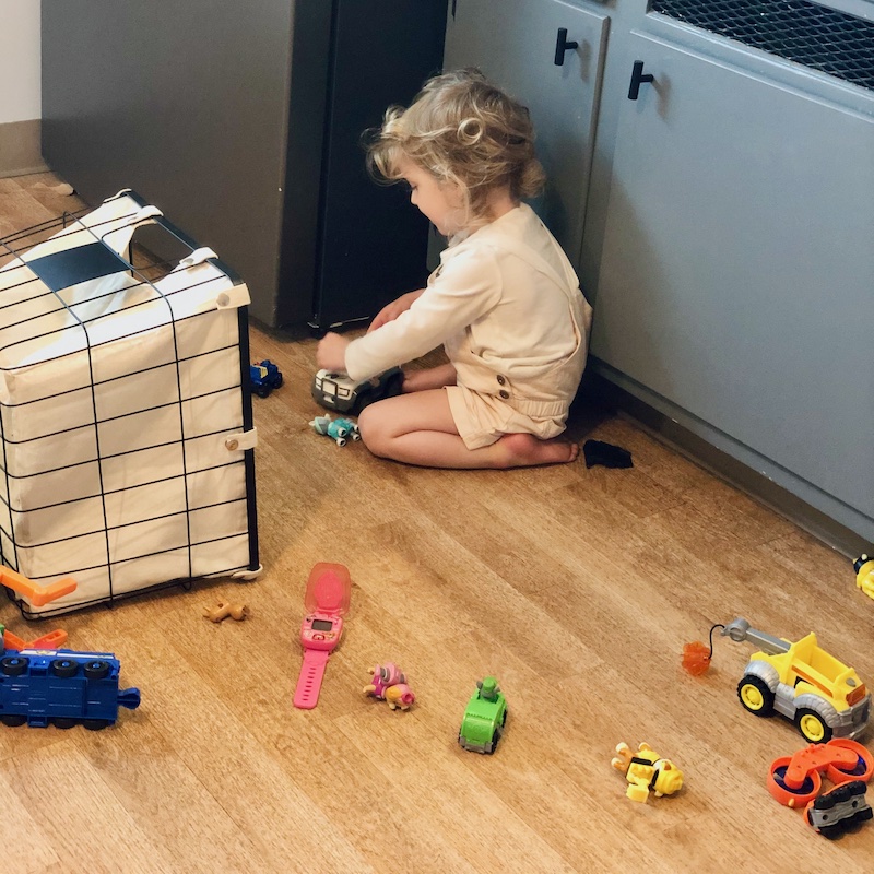 Toddler playing with Paw Patrol toys