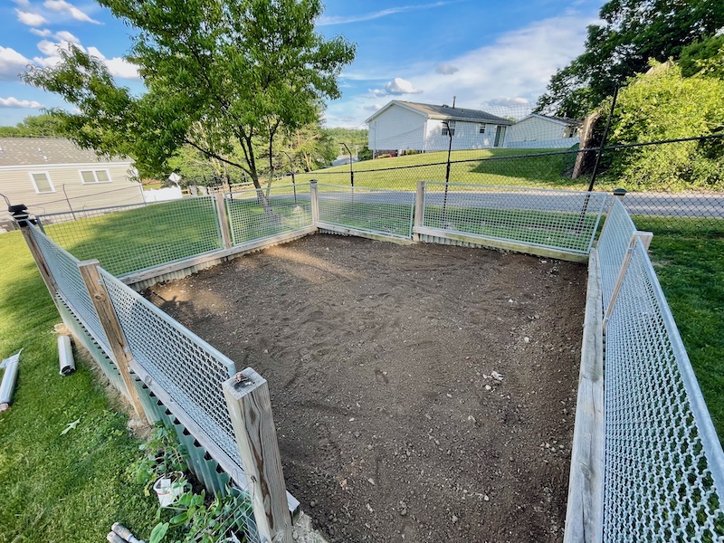 Vegetable garden plot with fence around it after being tilled in Pittsburgh, PA