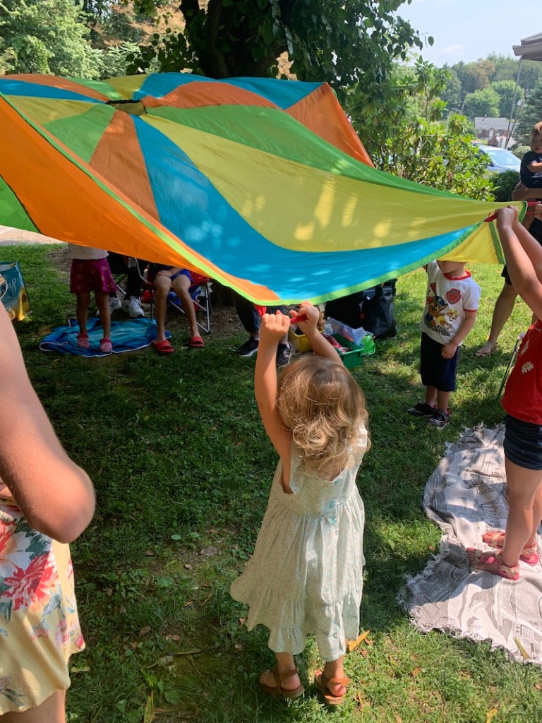 Kids playing with parachute