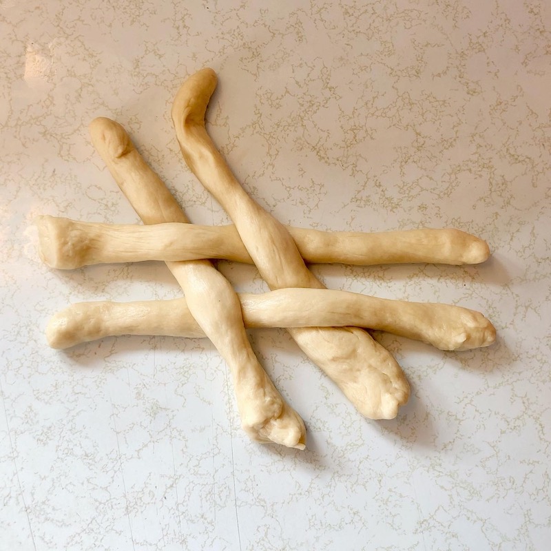 Braiding and weaving challah bread