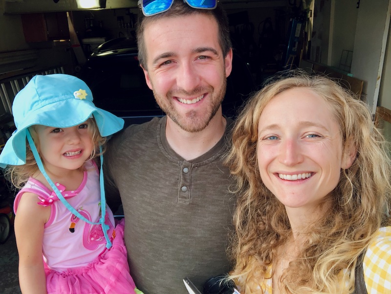 Family photo selfie with mom, dad, and toddler daughter