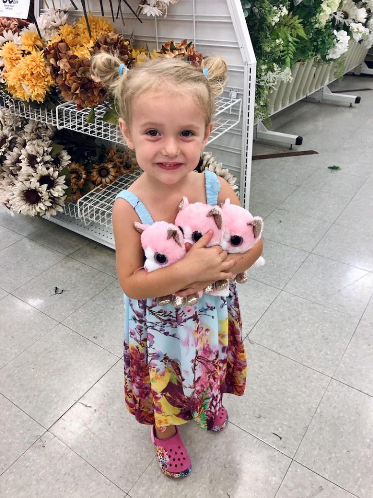 Toddler holding TY beanie boos