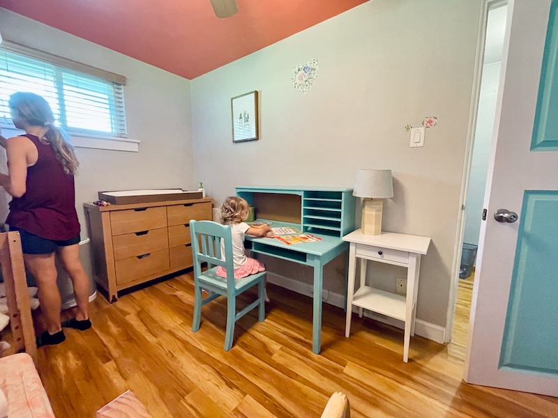 Toddler homeschool room and bedroom with blue desk