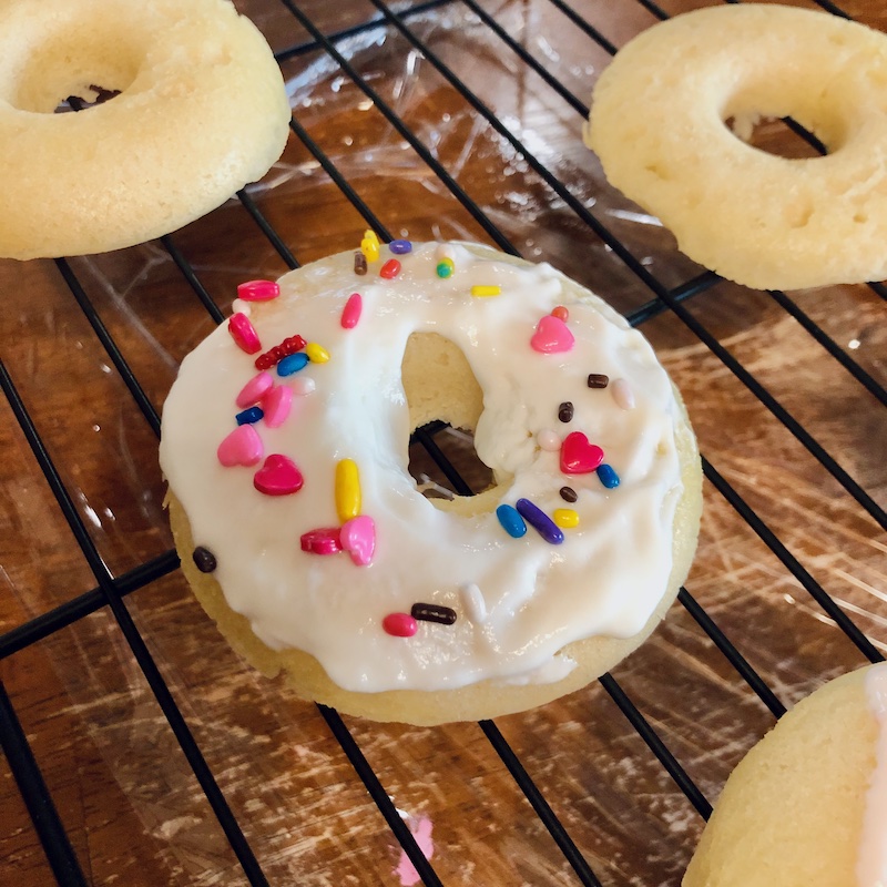Homemade baked donut with yogurt frosting and sprinkles